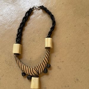 Tribal necklace of wood beads, bone from Africa